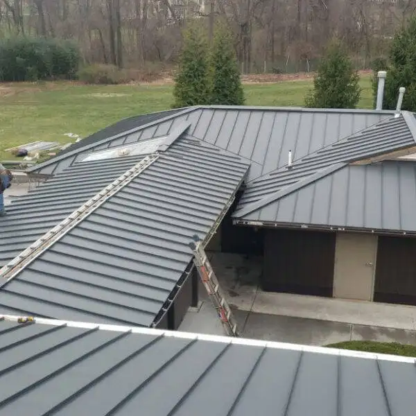 Metal roofing installation by TEO Construction, featuring durable and stylish metal roof materials.